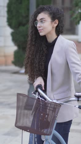 young woman riding a bicycle in the city