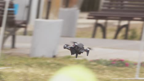 tracking shot of a dji fpv drone as it moves across and its movement is controlled