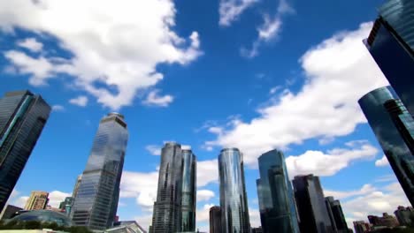 a breathtaking skyline under a brilliant blue sky: a stunning view of modern skyscrapers with dramatic clouds in a vibrant urban landscape