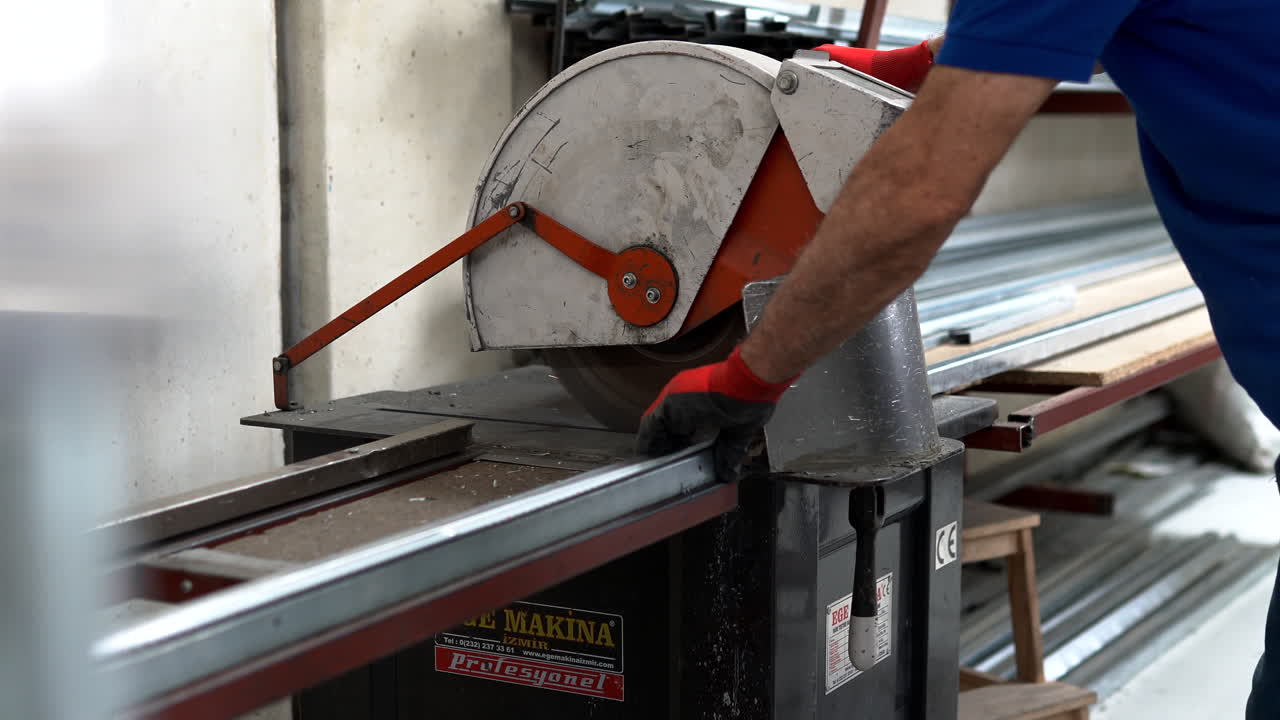 Factory Workers Operating PVC Frame Manufacturing Equipment