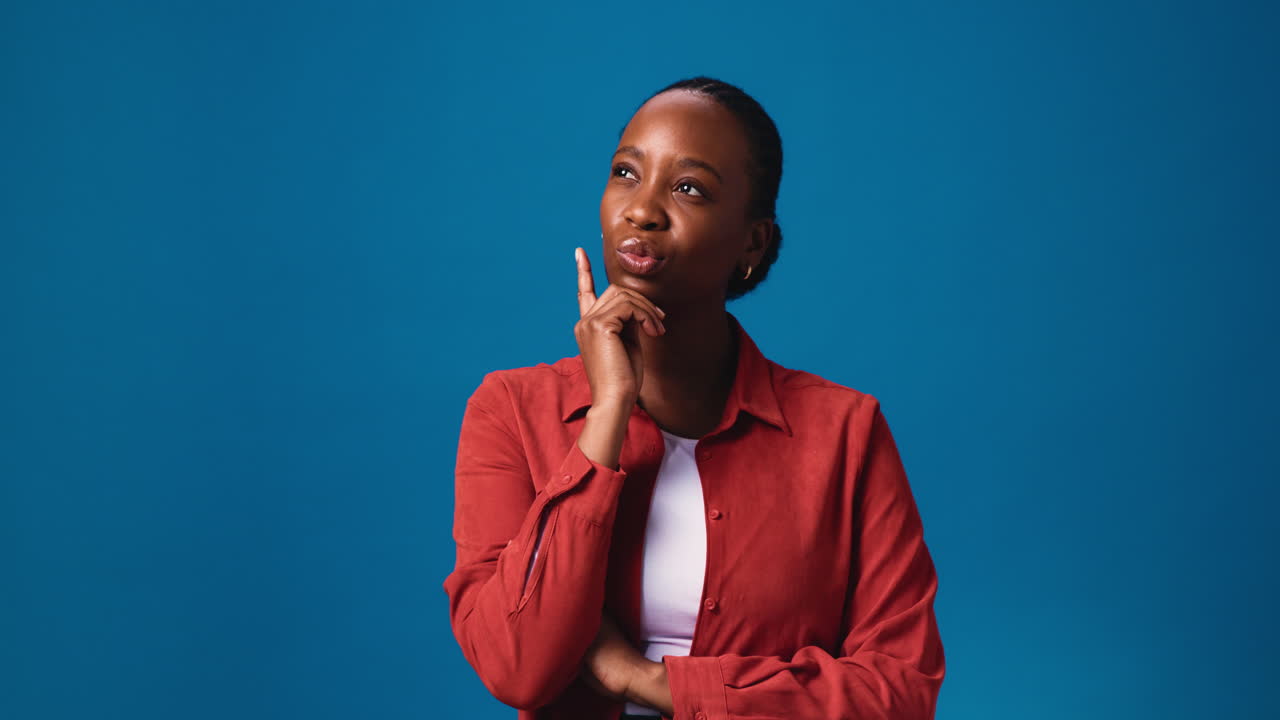 A thoughtful African American woman pondering a solution