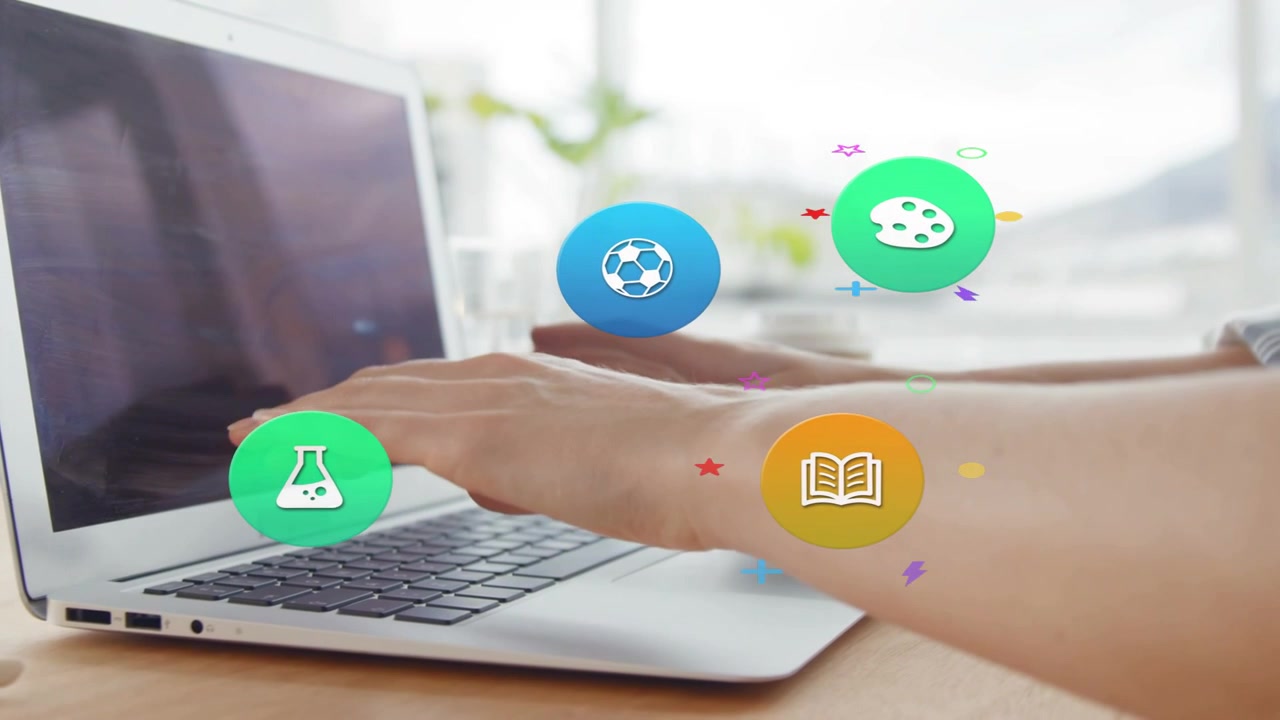 Peers placing hands on laptop keyboard, education book icon appearing above hands, organizing work