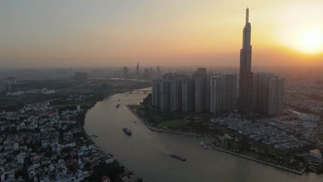 aerial drone in 4k over ho chi minh city, saigon skyline, vietnam