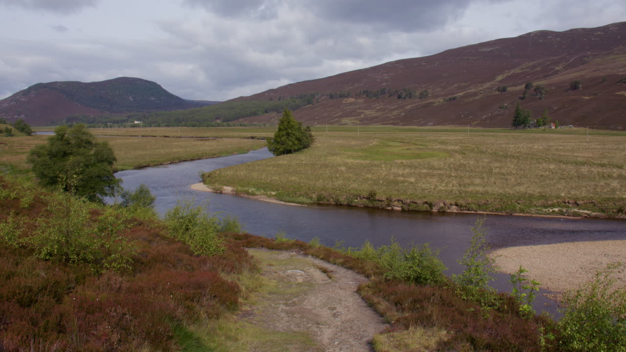 wide shot of the river Dee outside of the town of Braemar