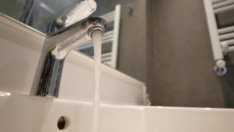 water running from bathroom faucet