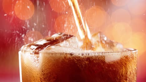 Glass-of-cola.-Ice-cola-with-splashing-bubbles-slow-motion-on-a-blurry-light-,blurry-background.