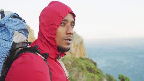 sporty mixed race man with prosthetic leg hiking