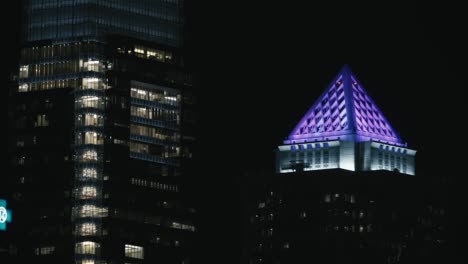 philadelphia skyline, at night, with buildings, lights, and reflections