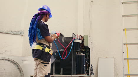 expert looking at refrigerant levels