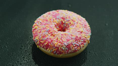 pink donut with sprinkles