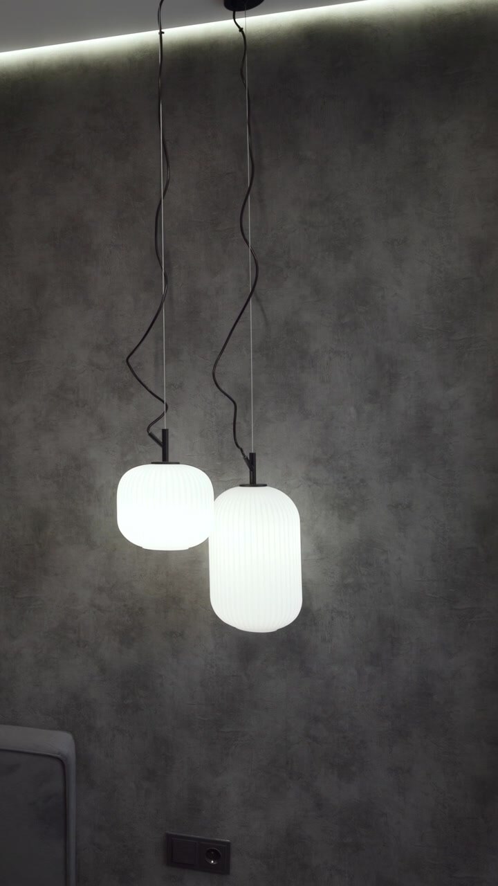 Moody Bedroom With Pendant Lights, Ribbed Plaster Accent Wall And Upholstered Headboard, Suspended Globe Lamps