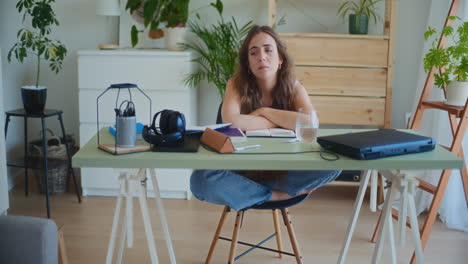 reflective sad woman at desk