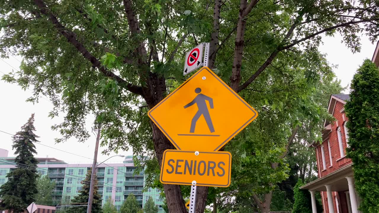 Senior citizen pedestrian neighborhood area safety crossing area road traffic warning signage