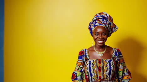 smiling african woman in vibrant traditional attire
