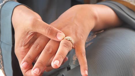 woman putting on a ring