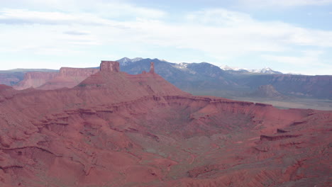 parrot mesa rock formation in the utah desert near moab, aerial establishing shot