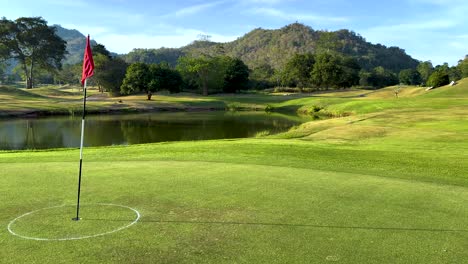 peaceful golf course with mountain backdrop