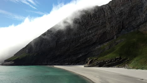 Revealing-aerial-footage-of-the-beach-on-the-island-of-Vaeroy,-Lofoten-Islands-in-Norway