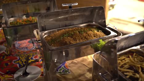 view of food in open buffet, close up shot, high angle shot
