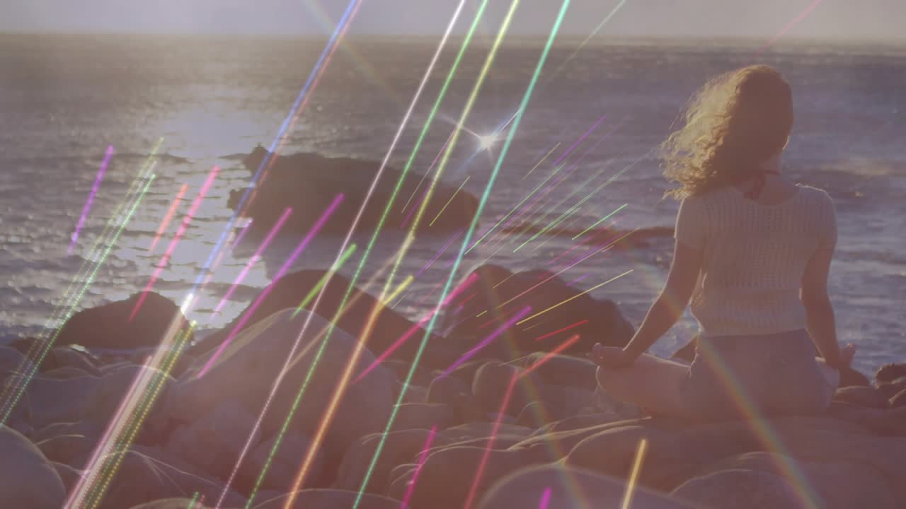 Music beat initiating light streaks across shore woman sitting rocks holding smartphone for content