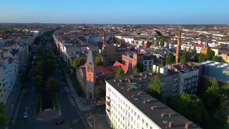 elevated train navigating through a residential area in berlin, showcasing the city's urban transportation system. magic aerial view flight rotation to right drone