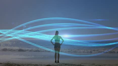 animación de líneas azules sobre mujer caucásica practicando yoga en la playa