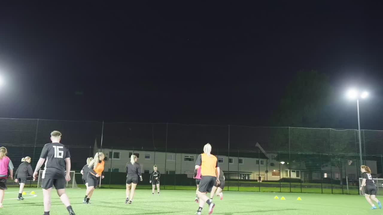 Women inspiring future generations of girls, showcasing football skill