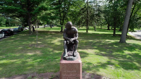 Aerial-upward-video-of-the-Pancratiast-statue-in-Roger-Williams-Park-in-Providence-RI