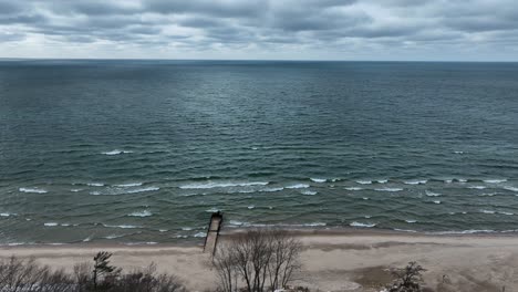 panning from a lakefront community to lake michigan