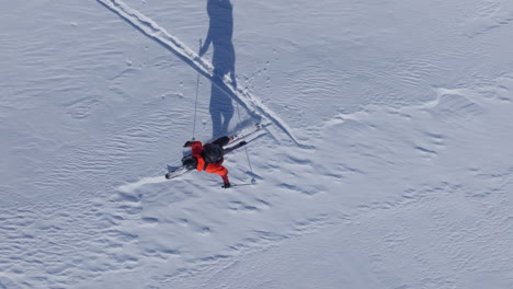 a professional skier hikes up a steep ridge in verbier, then drops into an epic freeride descent. pure adventure skiing in deep snow, dramatic terrain, and breathtaking alpine scenery.