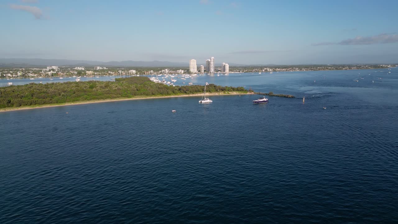 Aerial views of luxury yachts near Wavebreak Island and the Broadwater on the Northern end of the Gold Coast, Australia