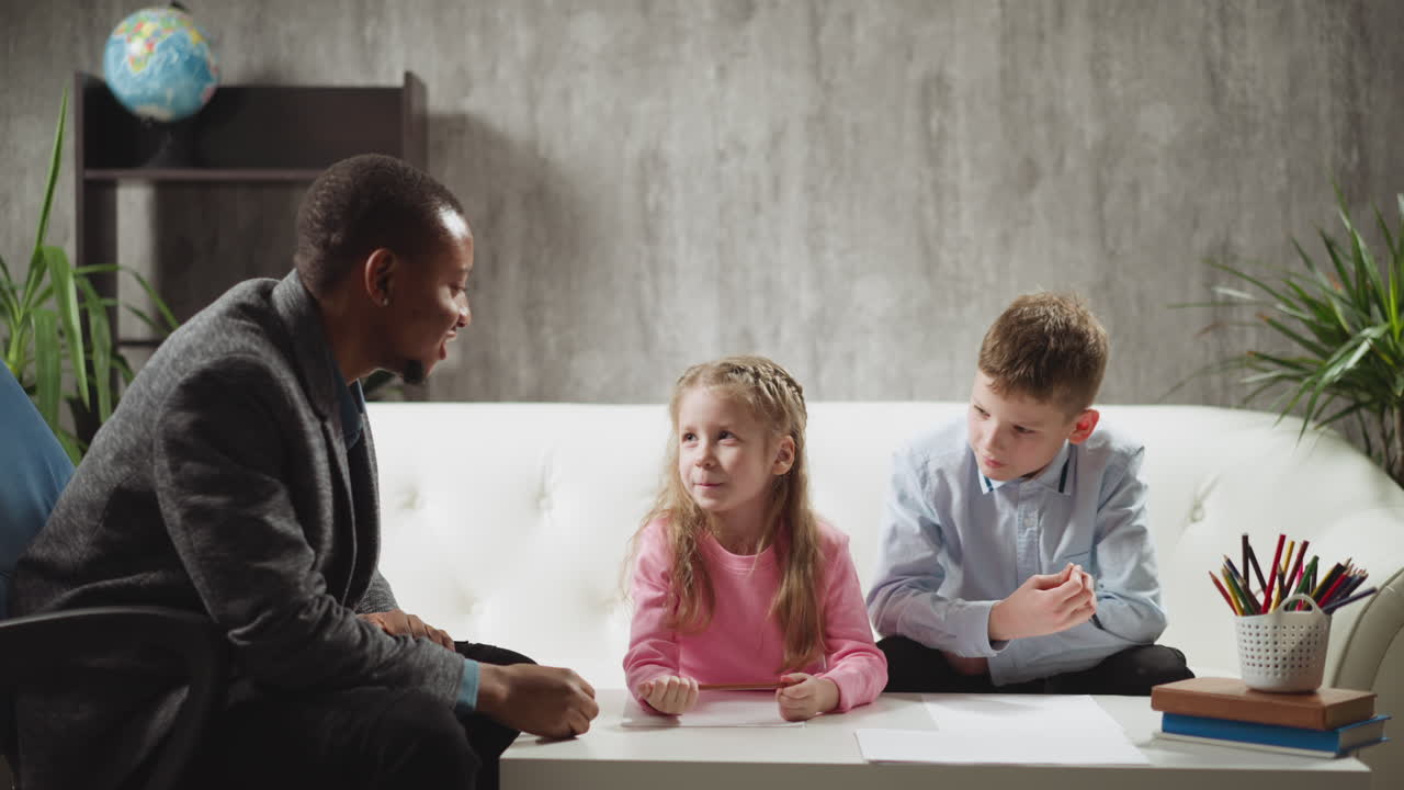 Little girl answers nodding tutor classmate sits on sofa