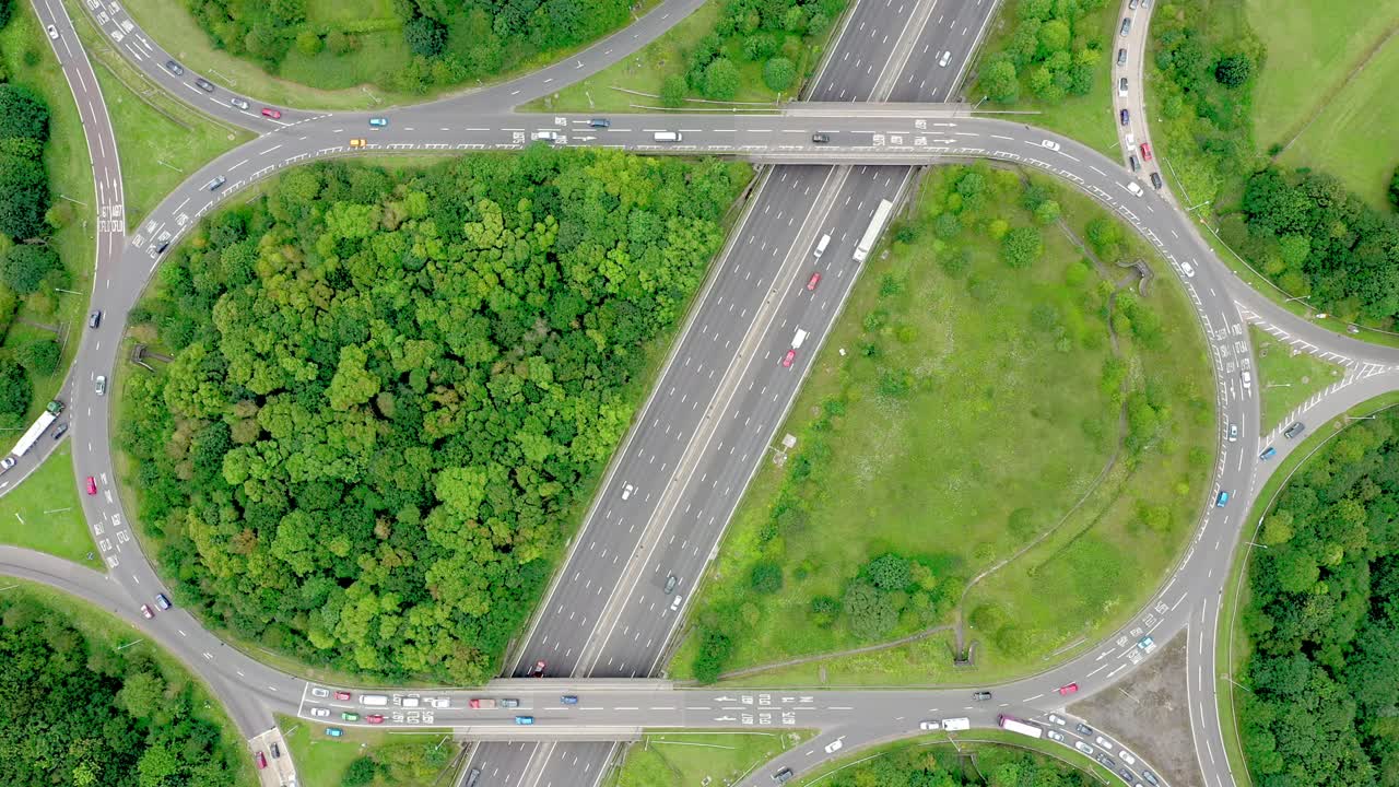 Drone birds-eye static view of a busy motorway junction