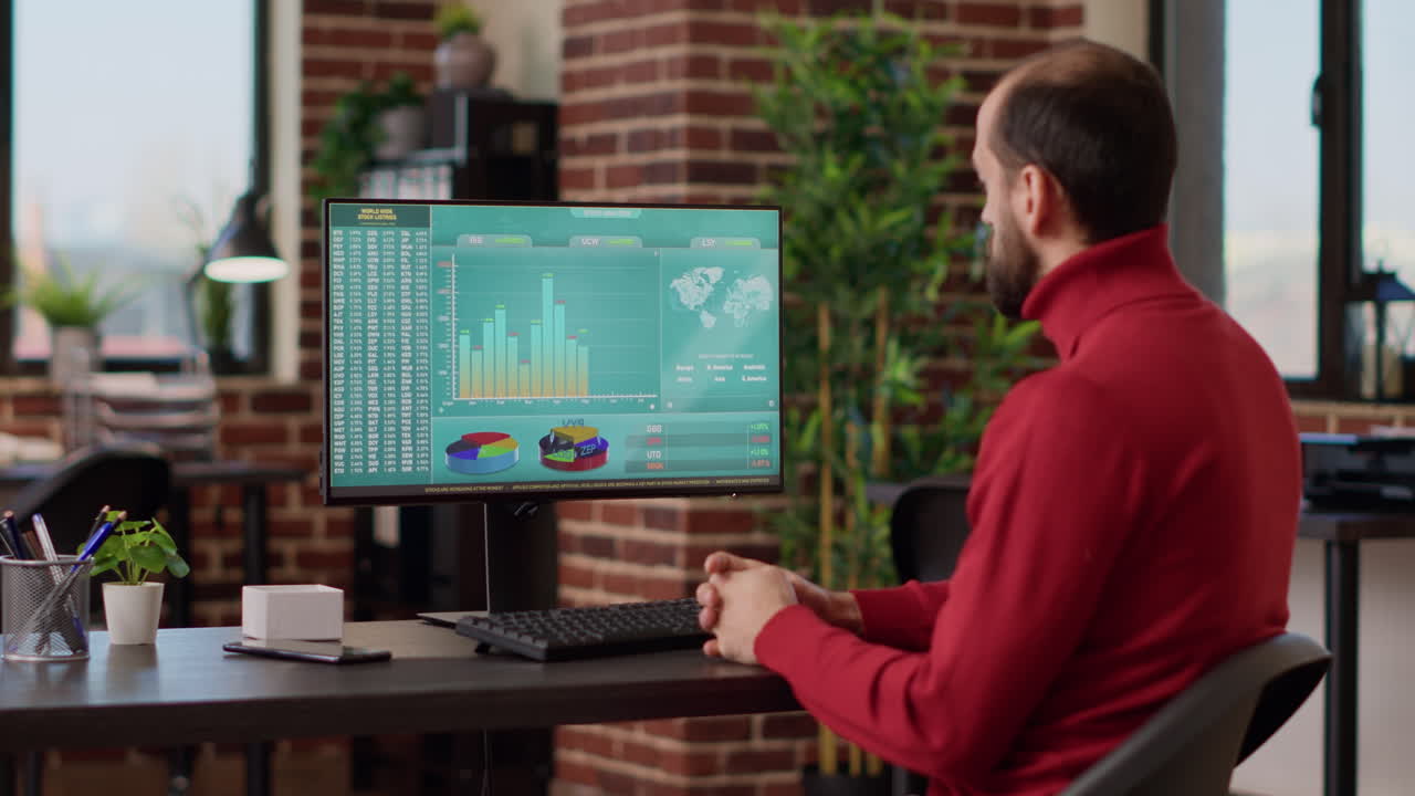 Male investor looking at stock trade sales on computer