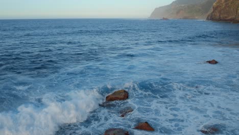 ocean waves crashing on a rocky coast