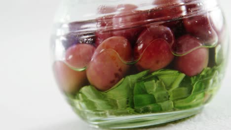 olives pickled with green vegetables in a jar