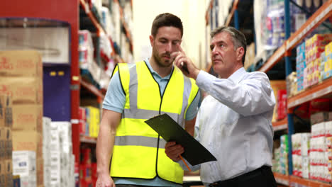 warehouse worker talking with his manager