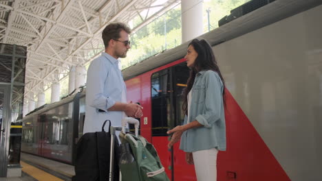 couple waiting for train at station