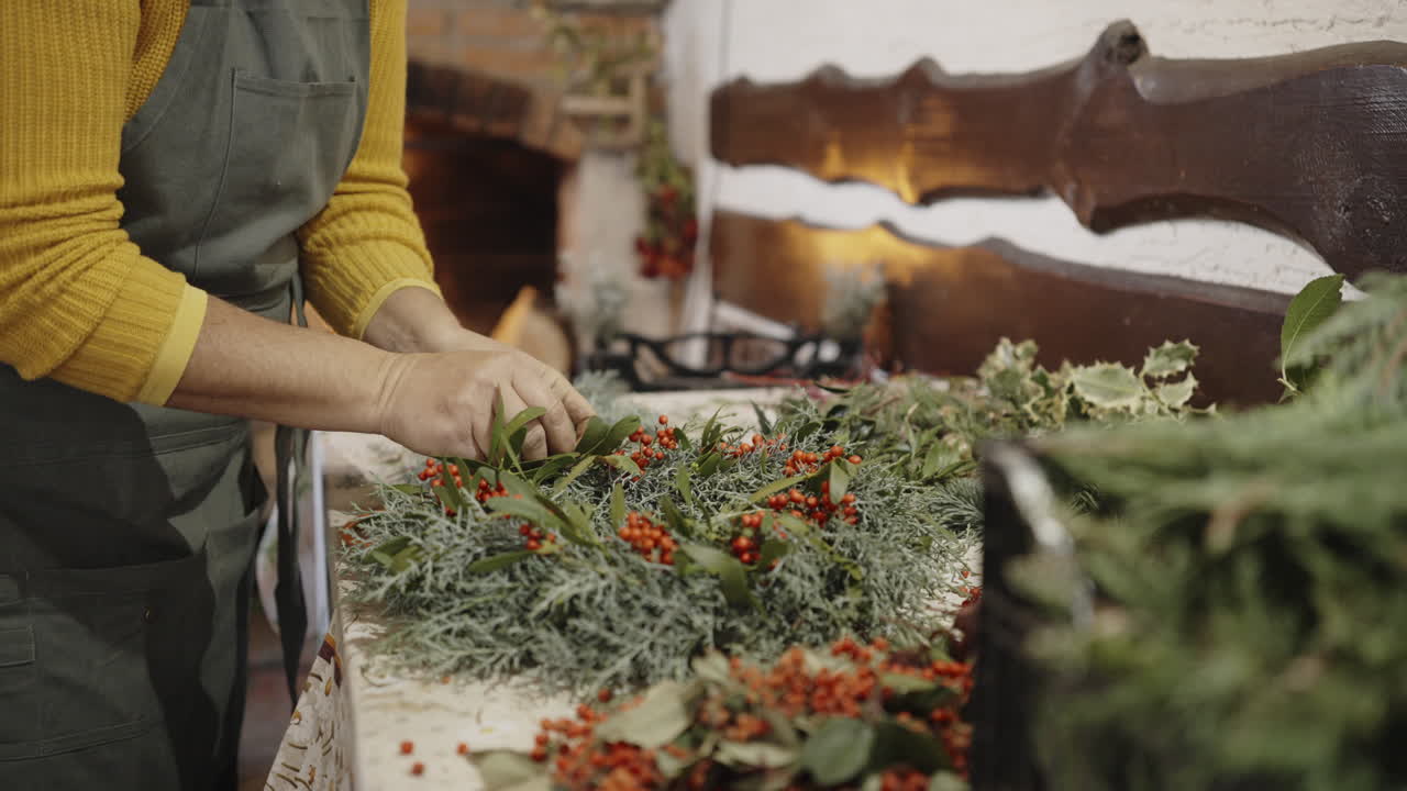 Making a Christmas Wreath by a Fireplace