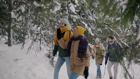 friends enjoying a winter hike in the forest