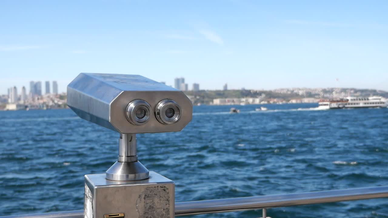 Tourist Binoculars at a Waterfront Viewpoint