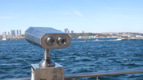 tourist binoculars at a waterfront viewpoint