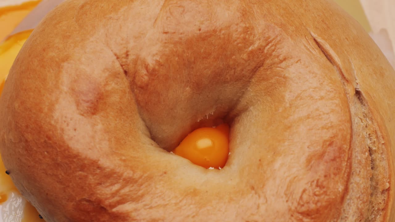 Bagel sandwich brunch, lunch plate of a bagel with smoked salmon and cream cheese and ham, close up morning cafe menu.