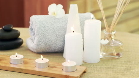 oil, towel, candles and stones