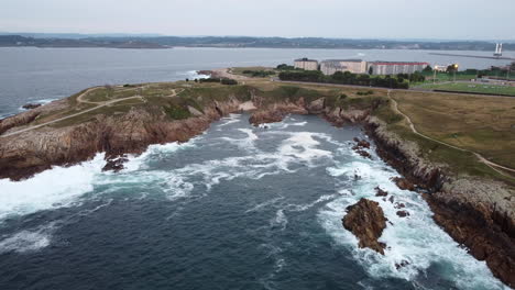 aerial pullback revealing wild atlantic ocean coastline - a coruña