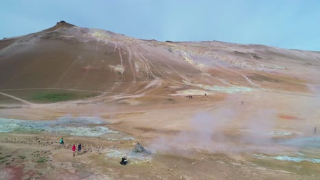 Dramatic-rising-aerial-over-Hverir-Myvatn-geothermal-area-in-iceland-reveals-the-lakes-distant--1