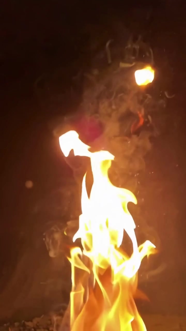 Close-Up of Dynamic Fire Flames Against a Dark Background