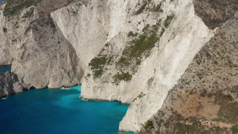 rocky steep cliffs with turquoise ionian sea in zakynthos island, greece