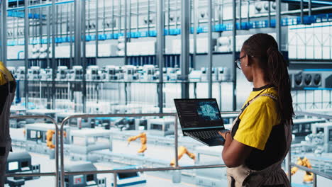 engineer in smart factory using augmented reality to collect data on laptop
