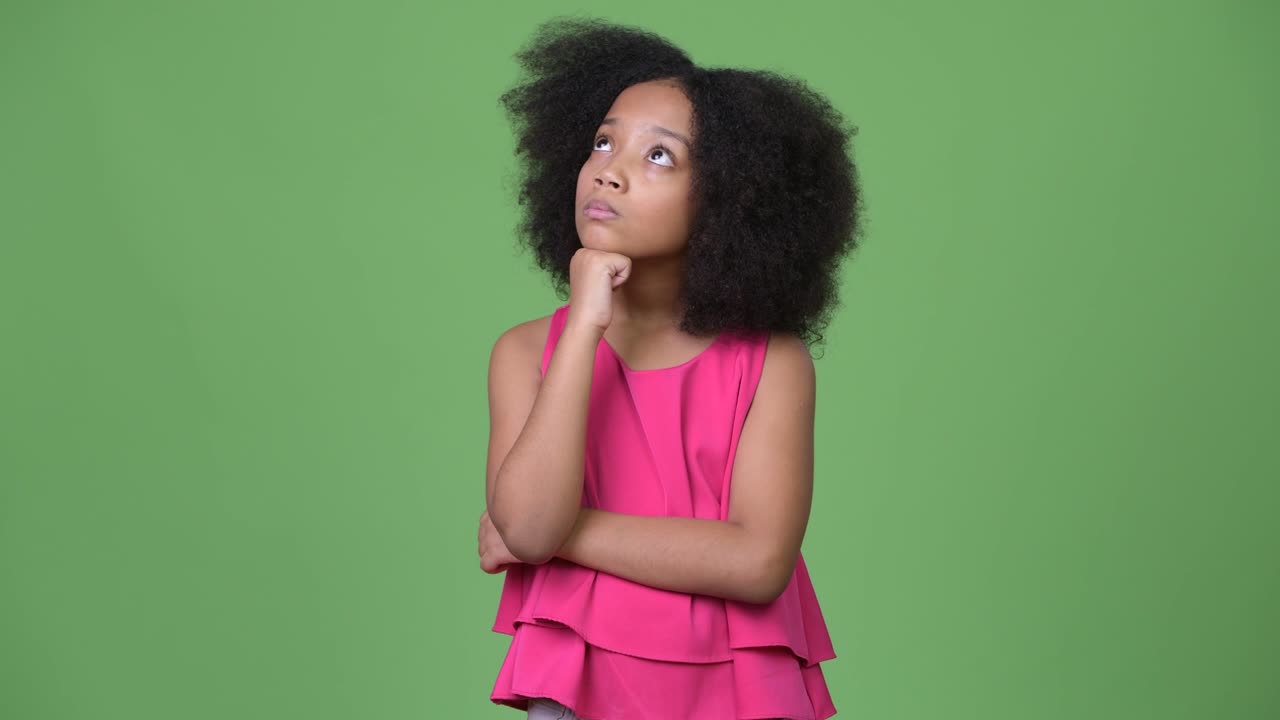 Young cute African girl with Afro hair thinking